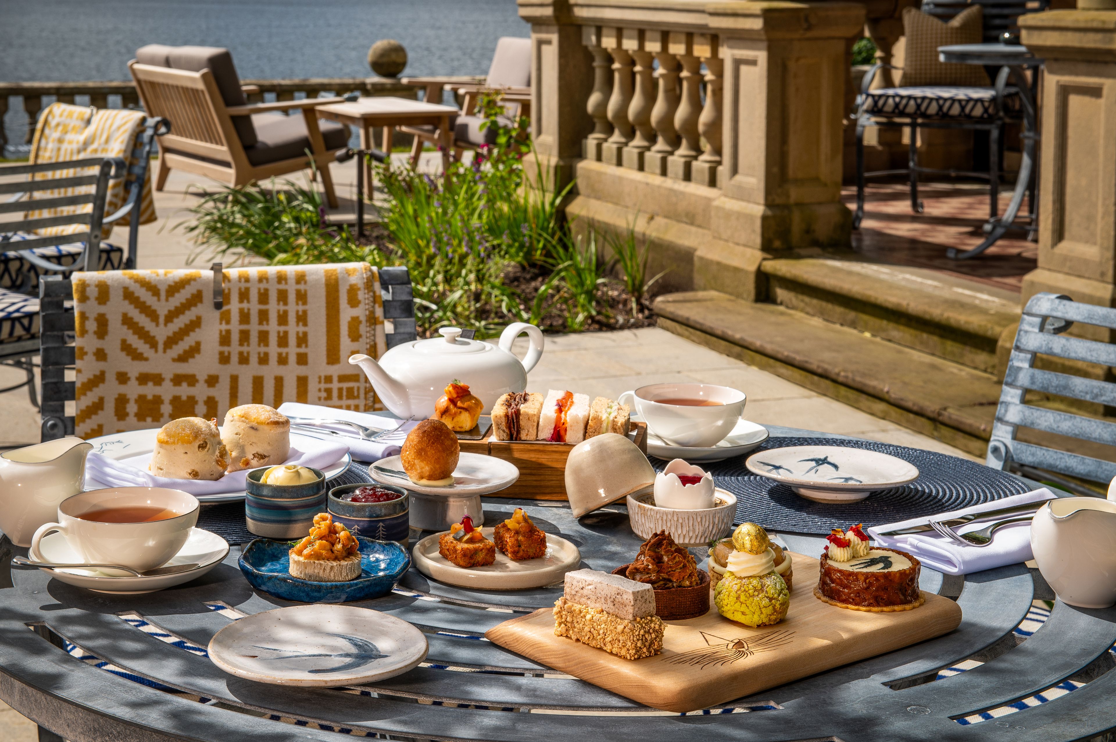 A spread of afternoon tea set outdoors