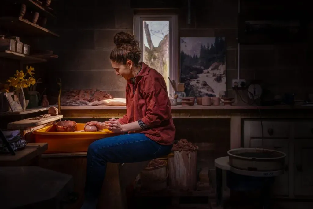 girl handcrafting ceramics in a studio