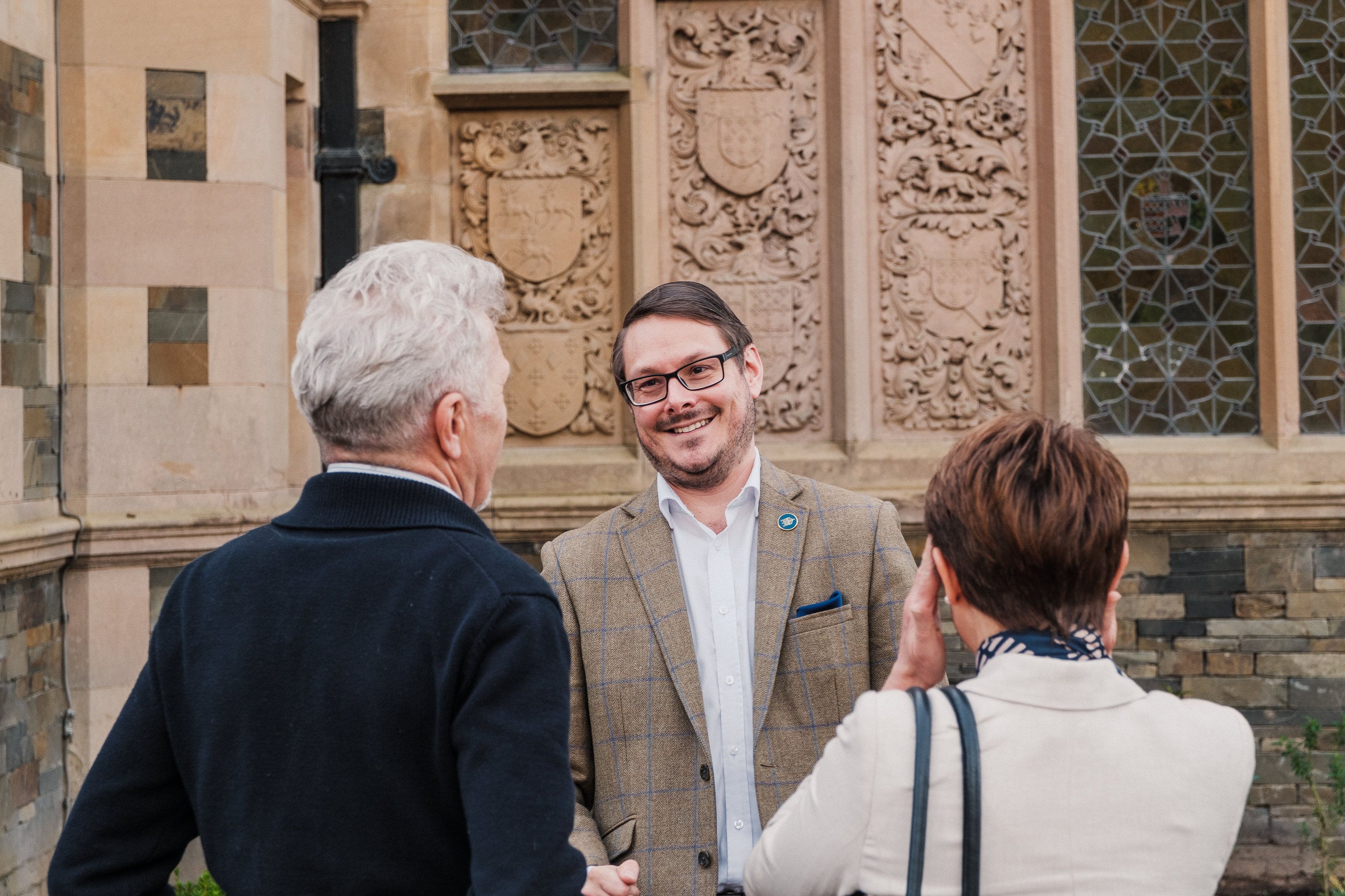 group of people smiling and talking